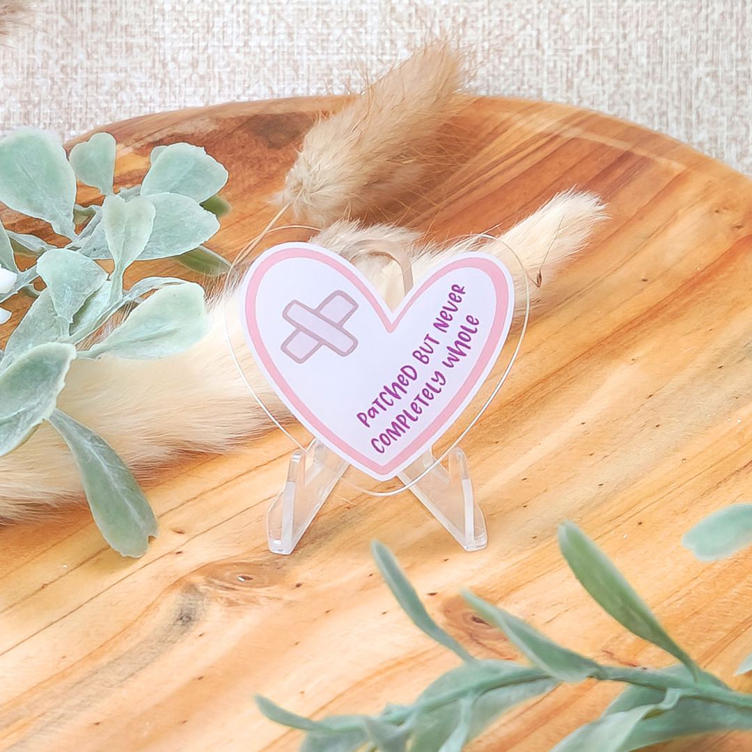 Patched but Never Completely Whole—Life after Loss (acrylic pin)